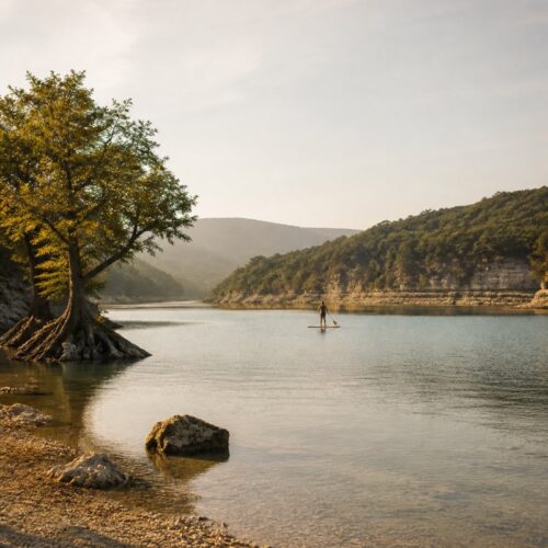 Paddleboarder on calm water at Canyon Lake, Texas